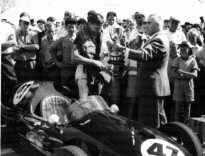 Bruce accepting the H.E. Melhop Trophy from Mr A. Walmsley 1959